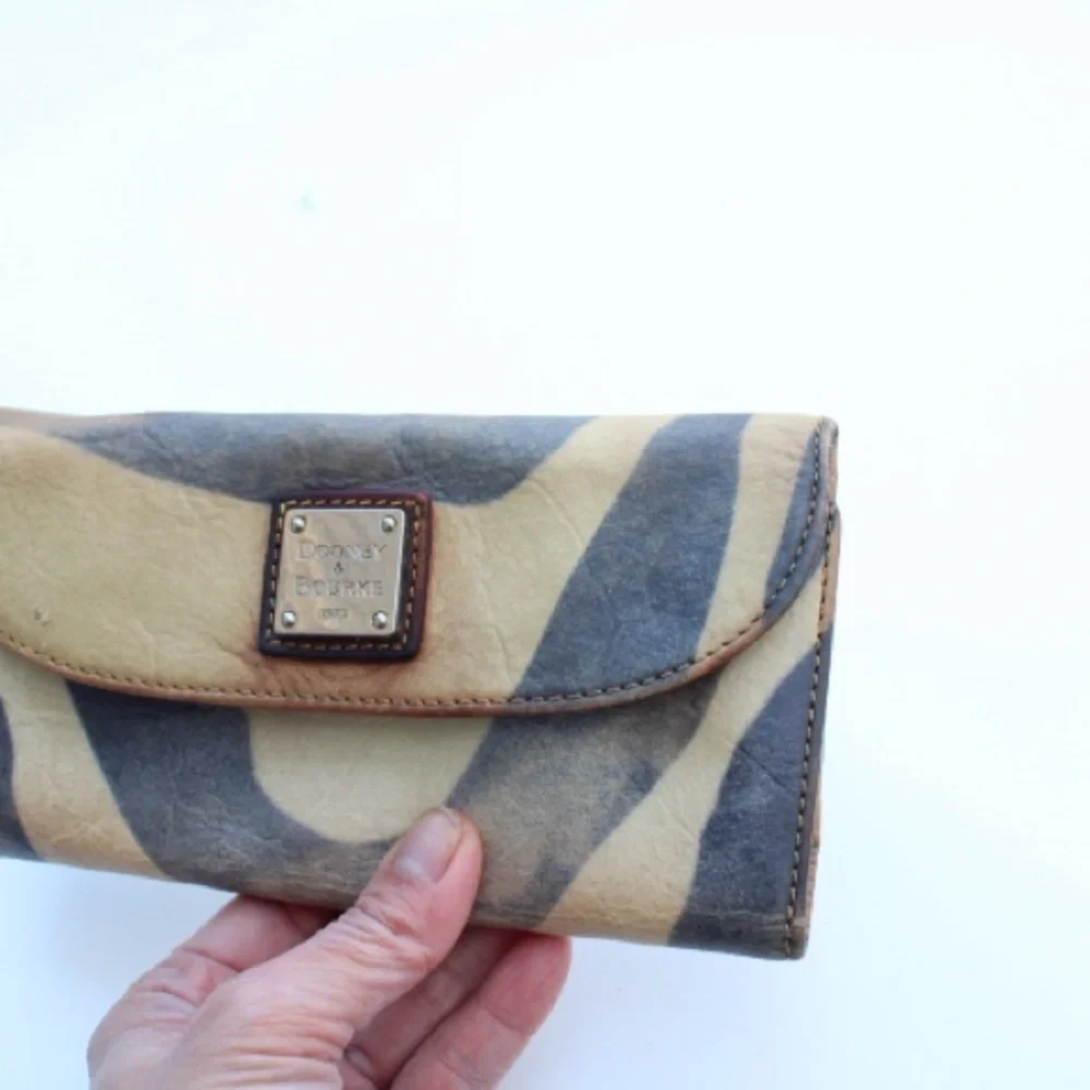Vintage Dooney & Bourke wallet  featuring a zebra print on leather.